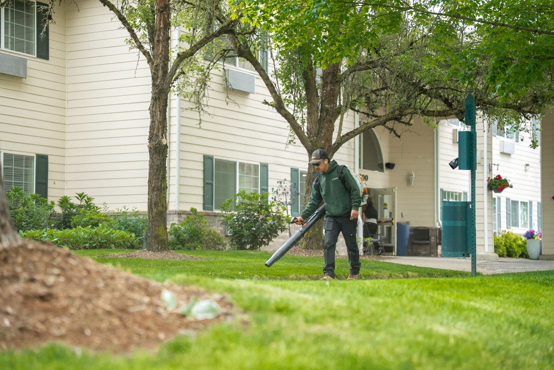 Seasonal landscape cleanup with blower service near commercial beds